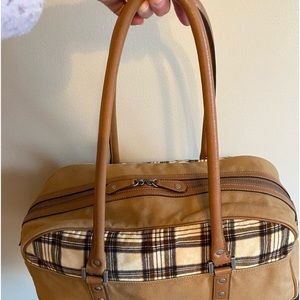 Burberry bag in like new condition. Small travel bag or large everyday bag.